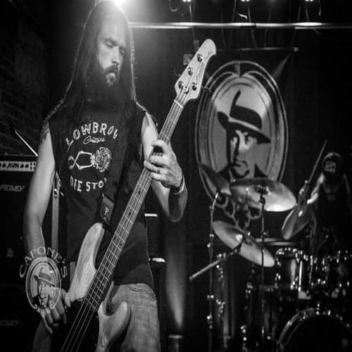 Jason Watson locked into a bass line on stage